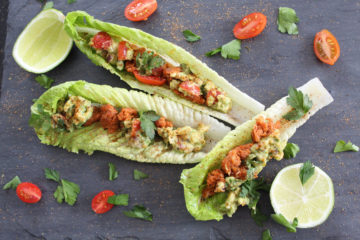 Lettuce leaves filled with chorizo, avocado, tomatoes, and cilantro