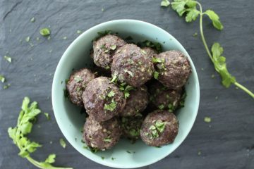 Meatballs in a bowl topped with cilantro