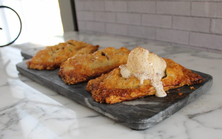 Brown sugar and cinnamon apple hand pies topped with ice cream