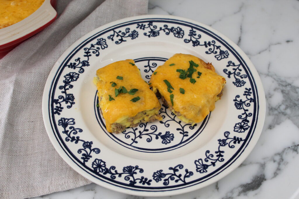 Two pieces of breakfast sausage casserole on a plate