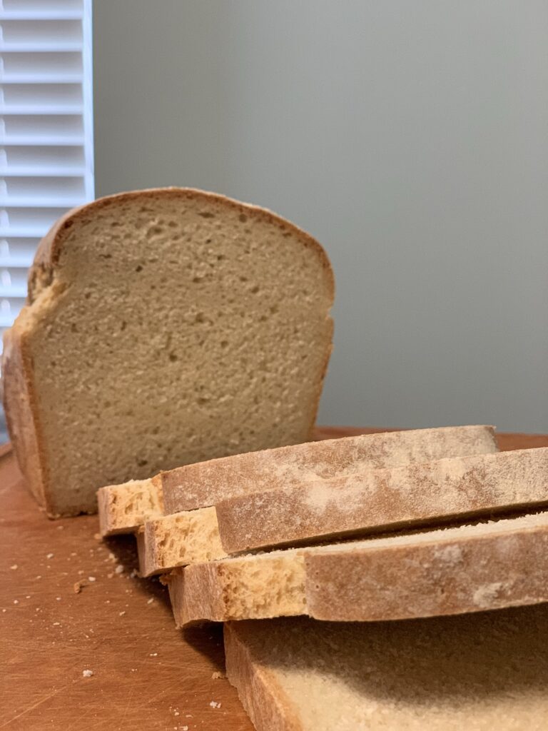 The essential white loaf vertical, slices up close