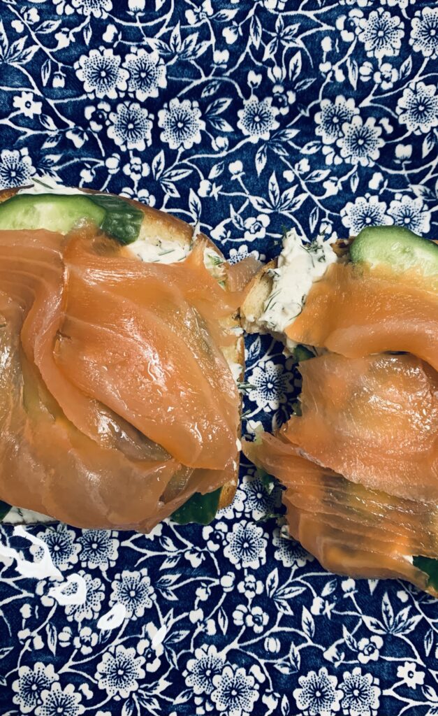 Smoked salmon, cucumber, dill cream cheese sandwich; blue and white plate